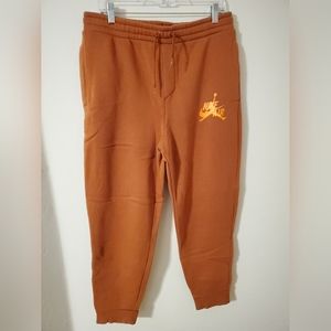 NIKE AIR JORDAN JOGGERS FLEECE PANTS ORANGE SIZE MEDIUM